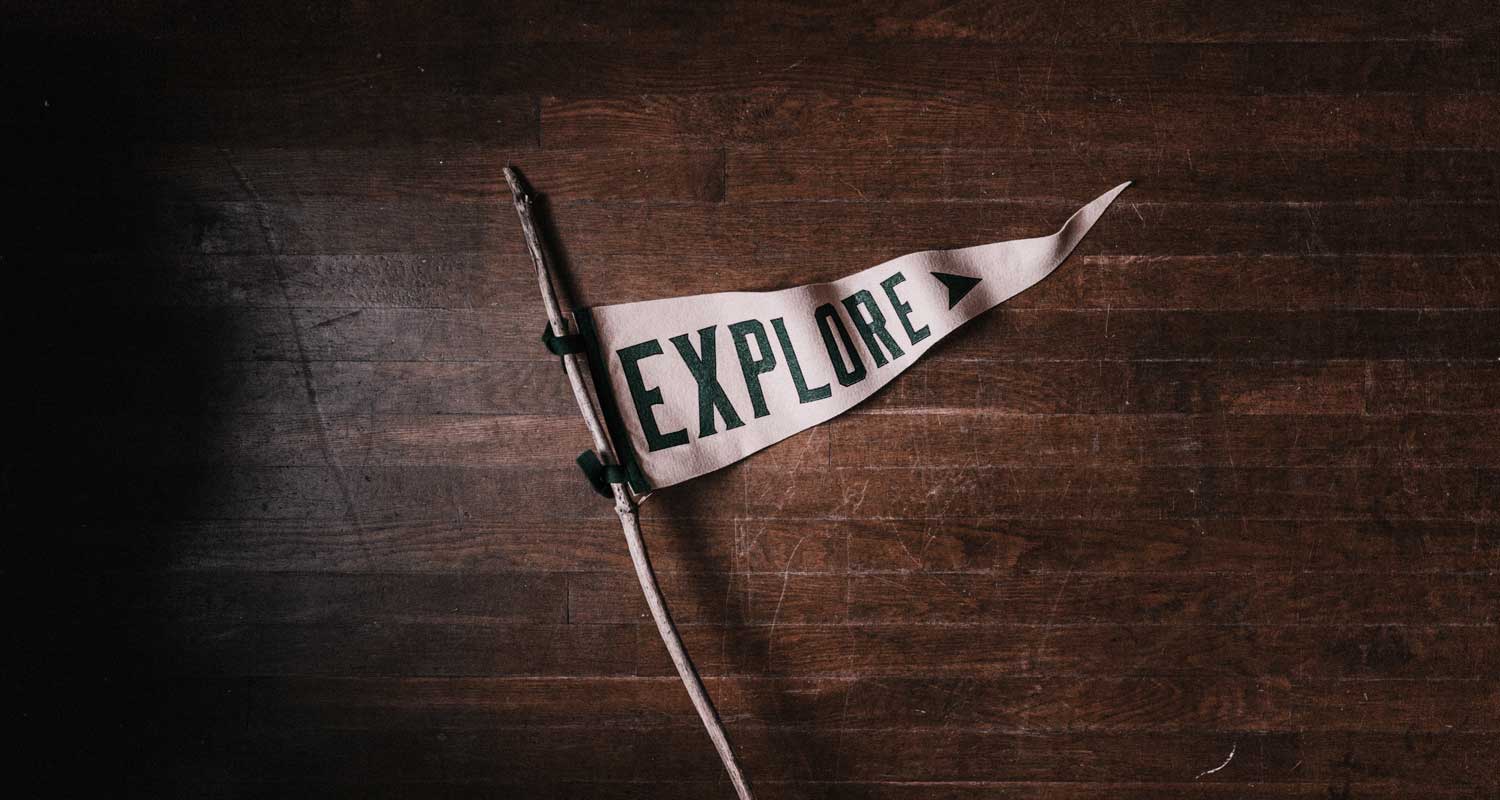 Triangular flag with explore on it