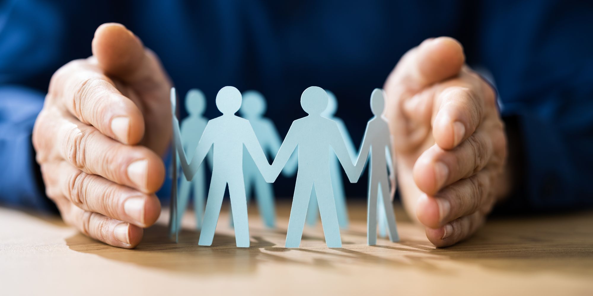 Retaining employees, paper stick people