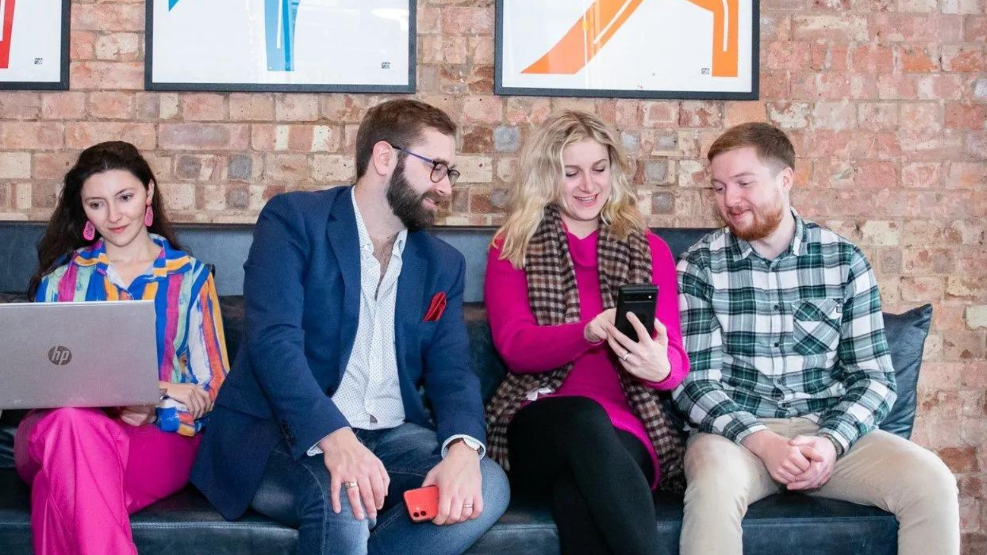 Wagada Digital team on a couch discussing ways to boost content marketing