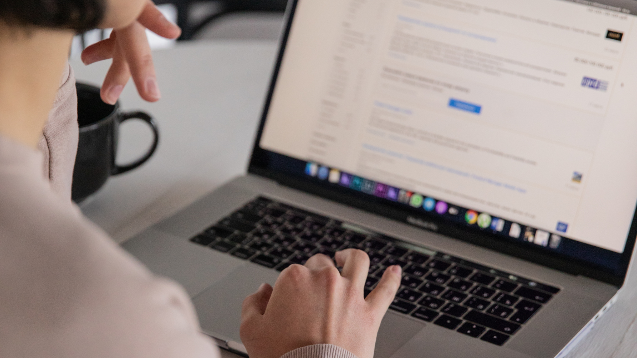 women scrolling on her laptop looking at a website